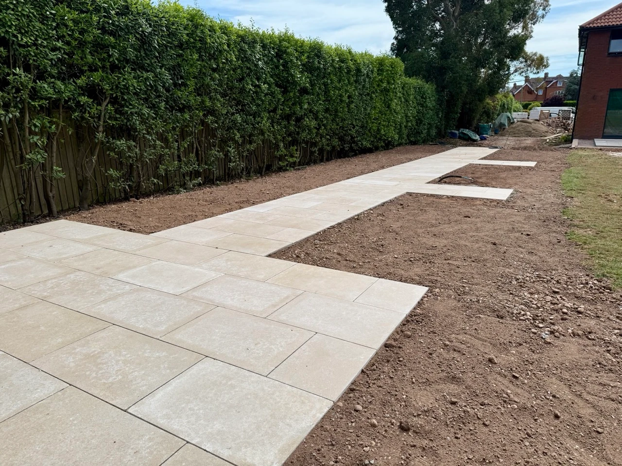 The finished limestone paving running alongside the hedge at Exton.