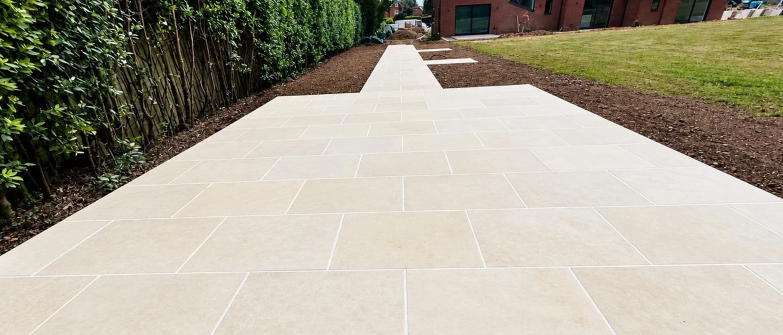 The finished limestone path running the length of the garden towards the house.