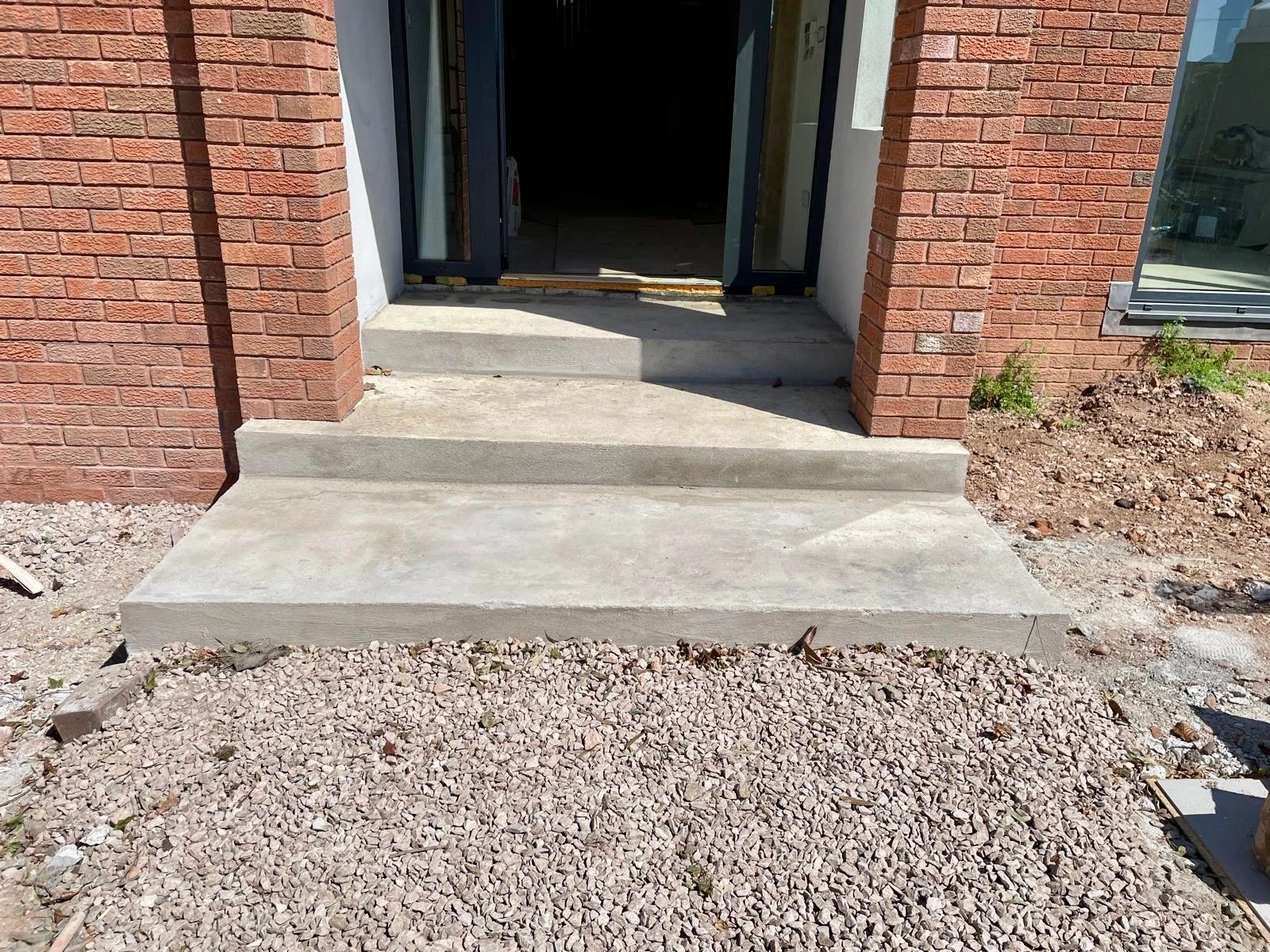 The steps formed and levelled in concrete, ready for the limestone to be laid over the top.