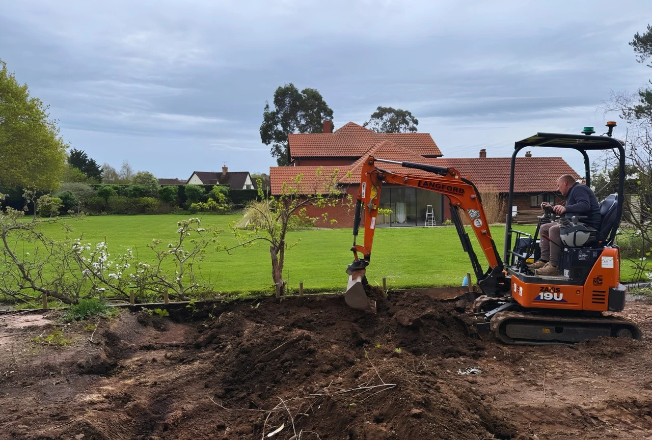 Graham working on site at Exton, levelling ground with the digger.