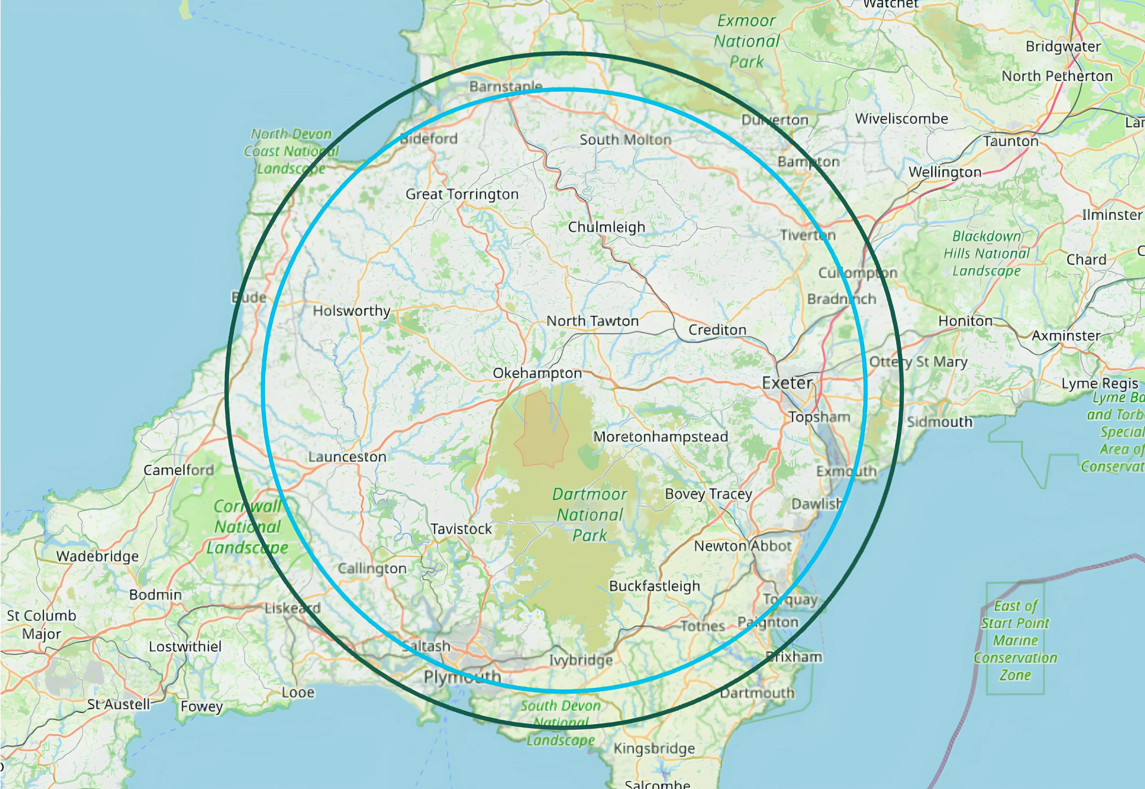 Map of Okehampton and surrounding towns, with a light blue inner ring at approximately 25 miles and a dark teal outer ring showing the broader working area.